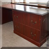 F28. Desk with file cabinets. 